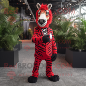 Red Zebra mascot costume character dressed with a Suit Jacket and Anklets