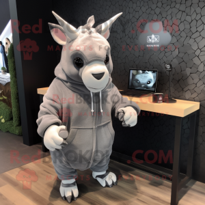 Gray Rhinoceros mascot costume character dressed with a Hoodie and Earrings