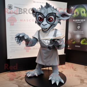 Gray Gargoyle mascot costume character dressed with a Dress Pants and Reading glasses