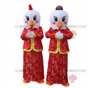 Mascotas de pájaros blancos en trajes rojos asiáticos -