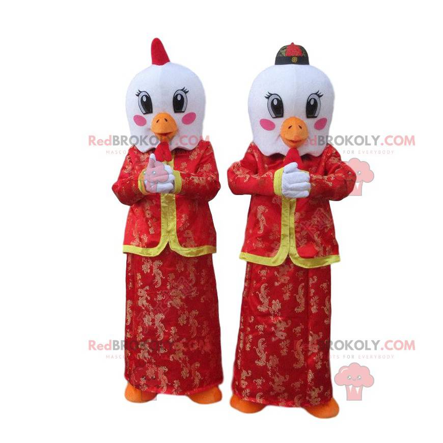 Mascotes de pássaros brancos em trajes asiáticos vermelhos -
