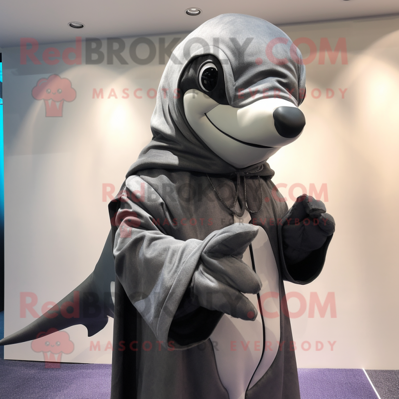 Silver Killer Whale mascot costume character dressed with a Coat and Wraps Silver Killer Whale mascot costume character dressed with a Coat and Wraps