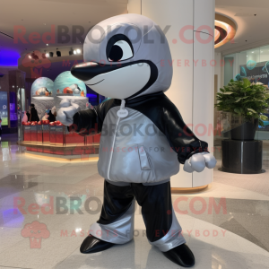 Silver Killer Whale mascot costume character dressed with a Coat and Wraps
