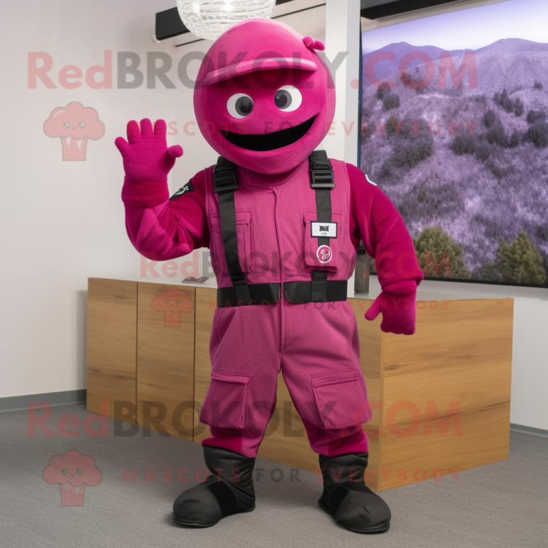 Magenta Para Commando mascot costume character dressed with a Overalls and Mittens