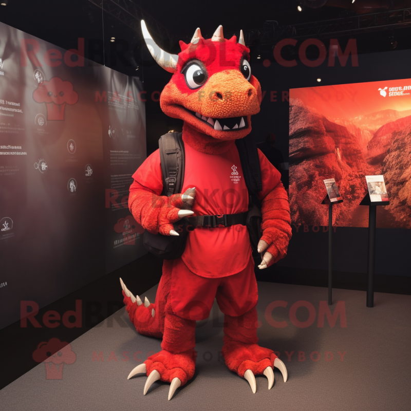 Red Dragon mascot costume character dressed with a Romper and Backpacks Red Dragon mascot costume character dressed with a Romper and Backpacks