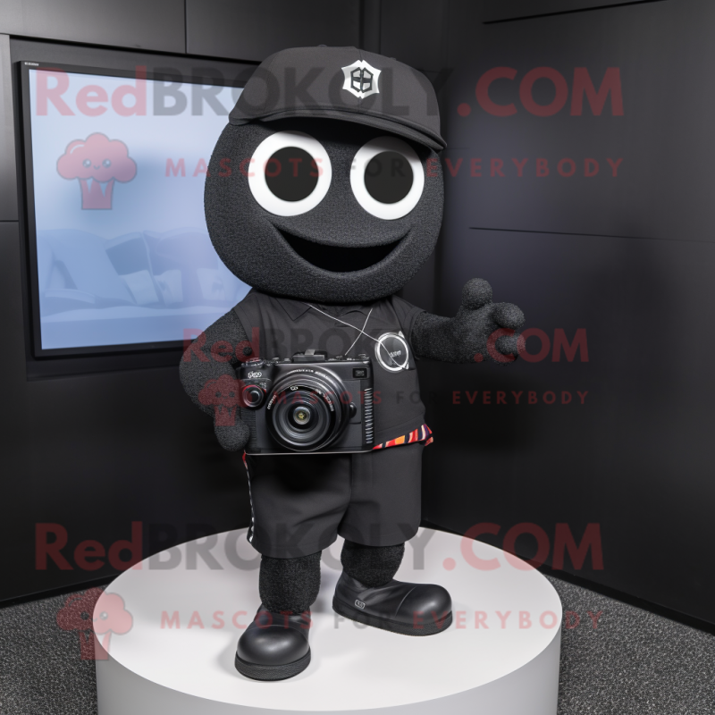 Black Camera mascot costume character dressed with a V-Neck Tee and Caps