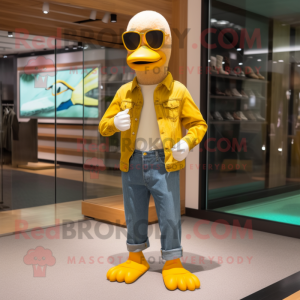 Yellow Goose mascot costume character dressed with a Corduroy Pants and Sunglasses