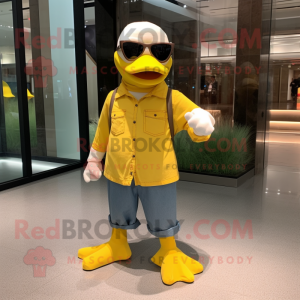 Yellow Goose mascot costume character dressed with a Corduroy Pants and Sunglasses