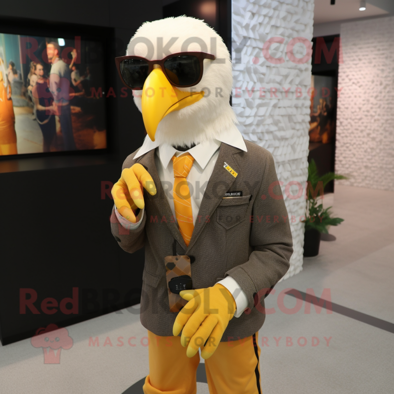 Yellow Bald Eagle mascot costume character dressed with a Suit Jacket and Eyeglasses