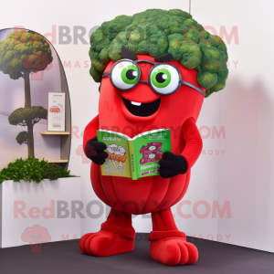 Red Broccoli mascot costume character dressed with a Graphic Tee and Reading glasses