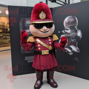 Maroon British Royal Guard mascot costume character dressed with a Moto Jacket and Keychains