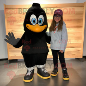 Black Pair Of Ice Skates mascot costume character dressed with a Culottes and Shoe clips