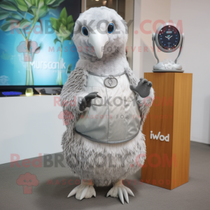 Silver Kiwi mascot costume character dressed with a Wrap Dress and Smartwatches