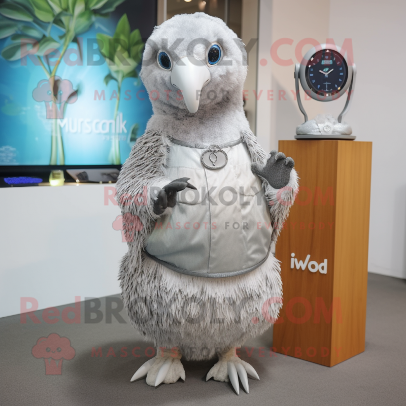 Silver Kiwi mascot costume character dressed with a Wrap Dress and Smartwatches