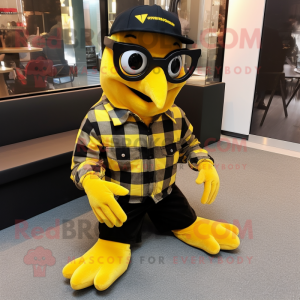 Gold Blackbird mascot costume character dressed with a Flannel Shirt and Reading glasses