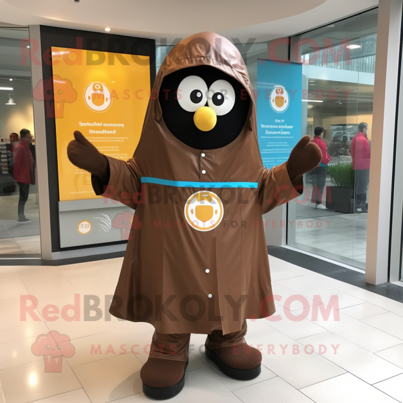 Brown Shakshuka mascot costume character dressed with a Raincoat and Cufflinks Brown Shakshuka mascot costume character dressed with a Raincoat and Cufflinks