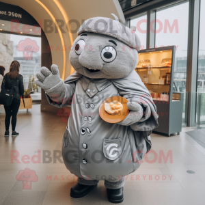 Gray Croissant mascot costume character dressed with a Raincoat and Bracelet watches