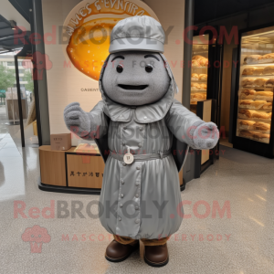 Gray Croissant mascot costume character dressed with a Raincoat and Bracelet watches