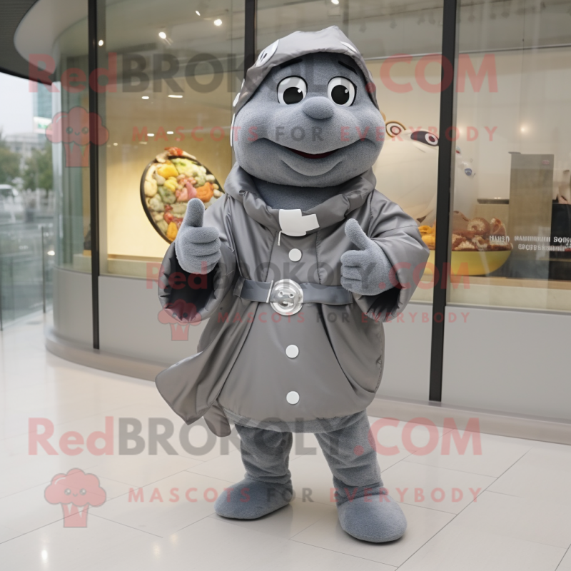 Gray Croissant mascot costume character dressed with a Raincoat and Bracelet watches