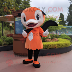 Orange Killer Whale mascot costume character dressed with a Shift Dress and Ties