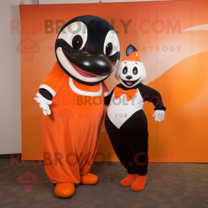 Orange Killer Whale mascot costume character dressed with a Shift Dress and Ties
