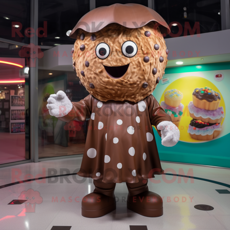 Brown Cupcake mascot costume character dressed with a Raincoat and Rings