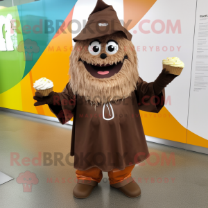 Brown Cupcake mascot costume character dressed with a Raincoat and Rings