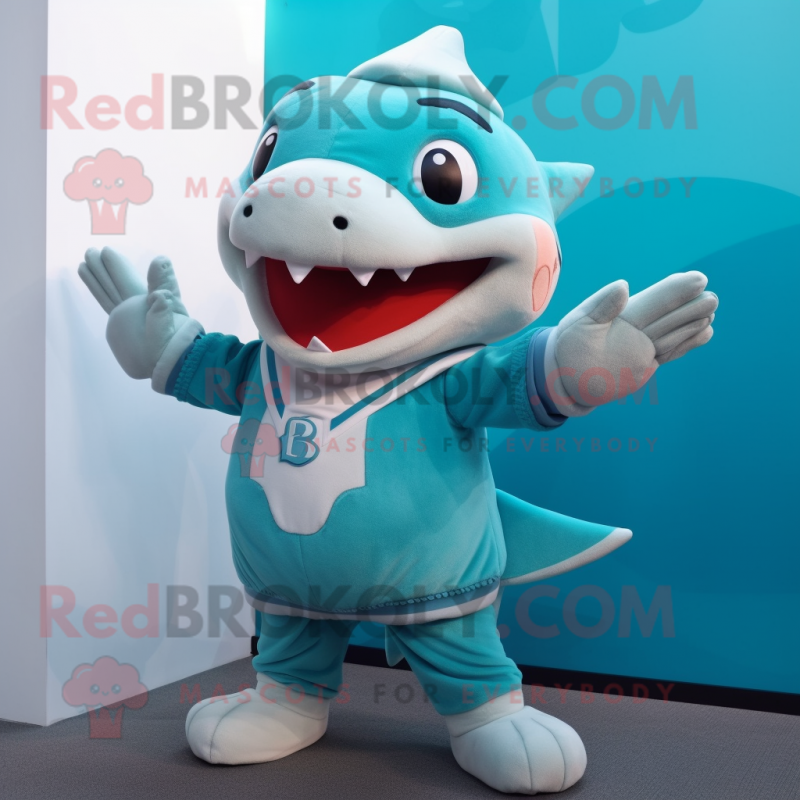 Turquoise Shark mascot costume character dressed with a Blouse and Mittens