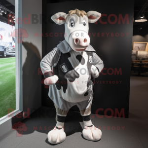 Silver Holstein Cow mascot costume character dressed with a Rugby Shirt and Suspenders