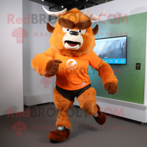 Orange Bison mascot costume character dressed with a Running Shorts and Smartwatches