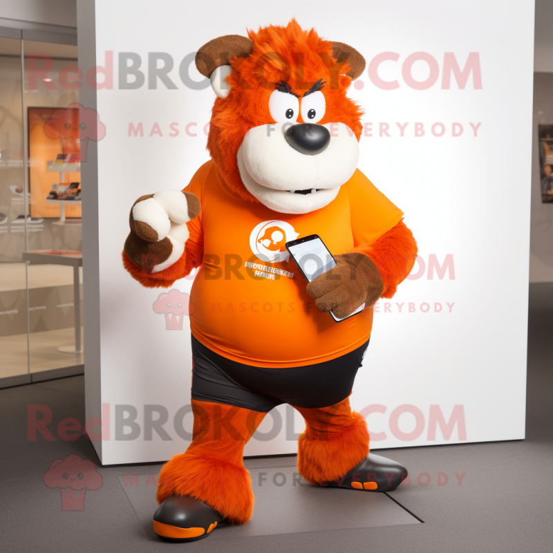 Orange Bison mascot costume character dressed with a Running Shorts and Smartwatches Orange Bison mascot costume character dressed with a Running Shorts and Smartwatches