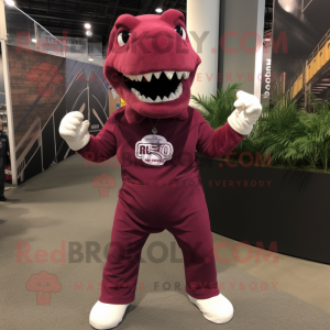 Maroon Tyrannosaurus mascot costume character dressed with a Joggers and Suspenders