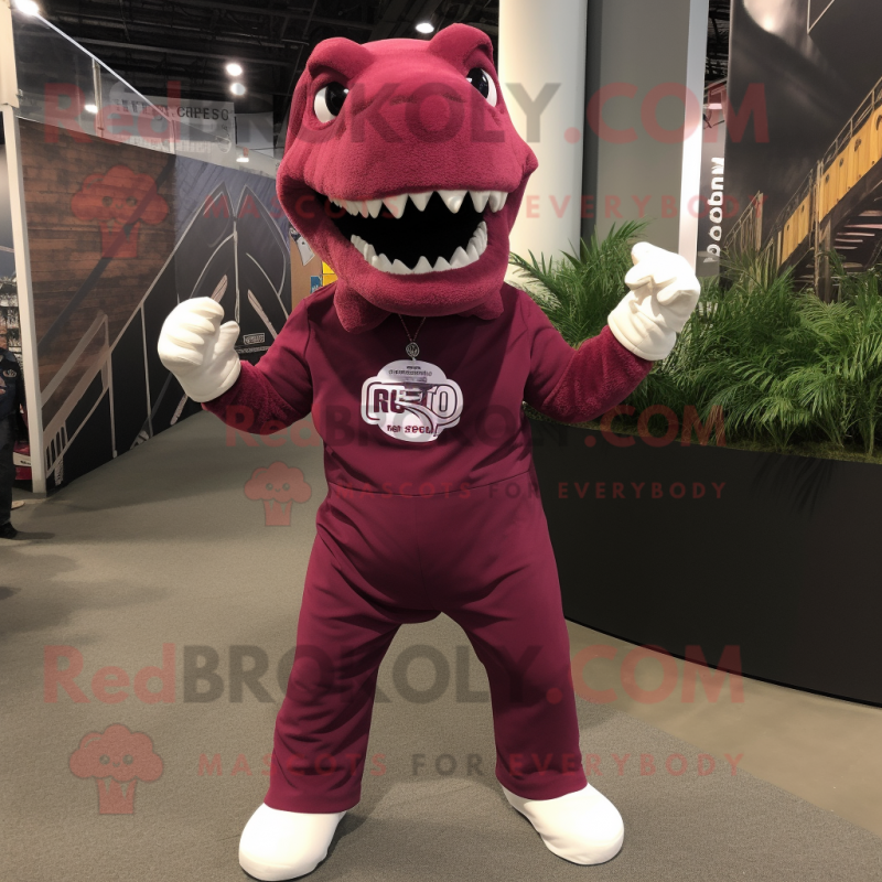 Maroon Tyrannosaurus mascot costume character dressed with a Joggers and Suspenders