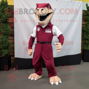 Maroon Tyrannosaurus mascot costume character dressed with a Joggers and Suspenders