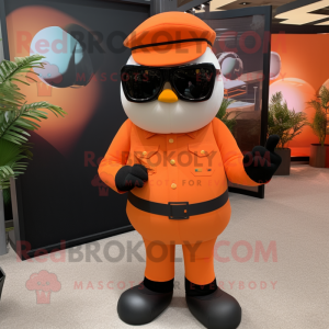 Orange Army Soldier mascot costume character dressed with a Tuxedo and Sunglasses