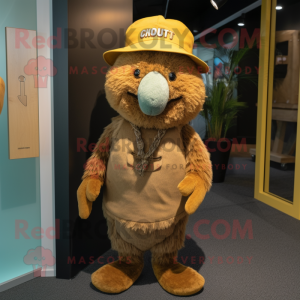 Gold Kiwi mascot costume character dressed with a Corduroy Pants and Hat pins