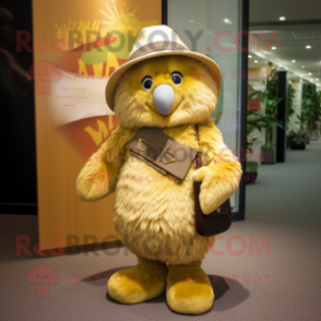 Gold Kiwi mascot costume character dressed with a Corduroy Pants and Hat pins