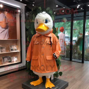 Peach Muscovy Duck mascot costume character dressed with a Raincoat and Headbands