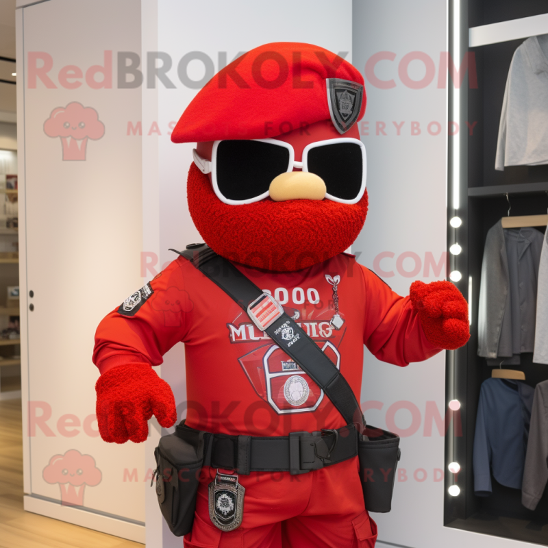 Red Commando mascot costume character dressed with a Vest and Necklaces