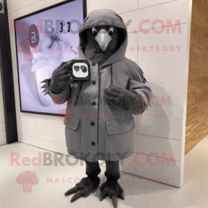 Gray Blackbird mascot costume character dressed with a Parka and Smartwatches