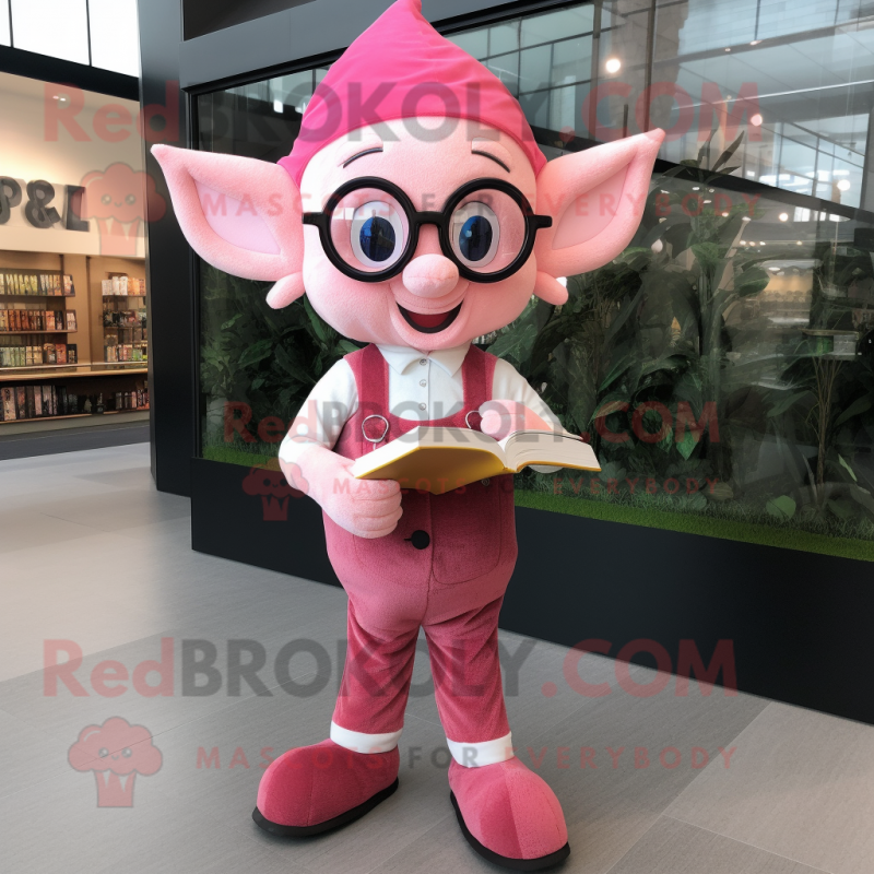 Pink Elf mascot costume character dressed with a Overalls and Reading glasses