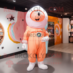 Peach Astronaut mascot costume character dressed with a Yoga Pants and Shawl pins
