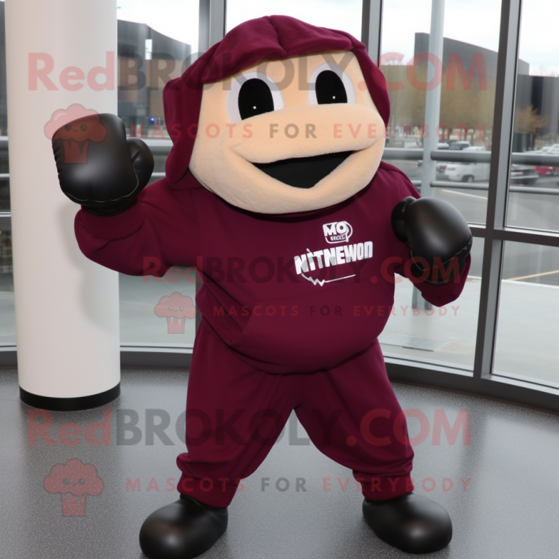 Maroon Boxing Glove mascot costume character dressed with a Hoodie and Ties Maroon Boxing Glove mascot costume character dressed with a Hoodie and Ties