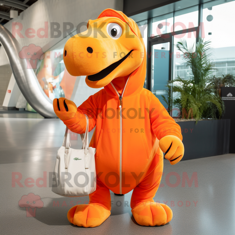 Orange Diplodocus mascot costume character dressed with a Sweatshirt and Tote bags