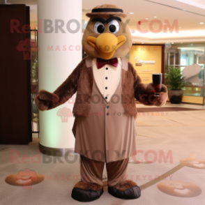 Brown Champagne mascot costume character dressed with a Dress Pants and Shawl pins