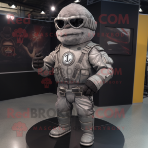 Gray Human Cannon Ball mascot costume character dressed with a Moto Jacket and Lapel pins