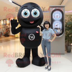 Black Miso Soup mascot costume character dressed with a Mom Jeans and Digital watches