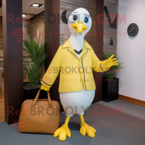 Yellow Seagull mascot costume character dressed with a Blazer and Tote bags