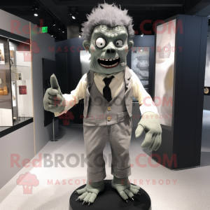 Gray Frankenstein'S Monster mascot costume character dressed with a Playsuit and Tie pins