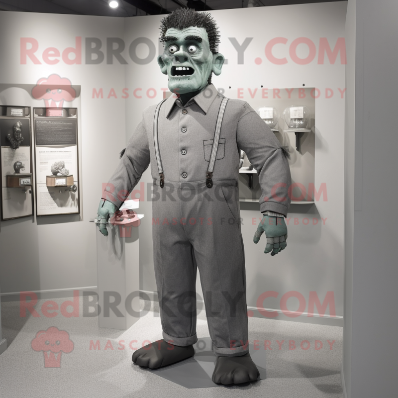 Gray Frankenstein'S Monster mascot costume character dressed with a Playsuit and Tie pins